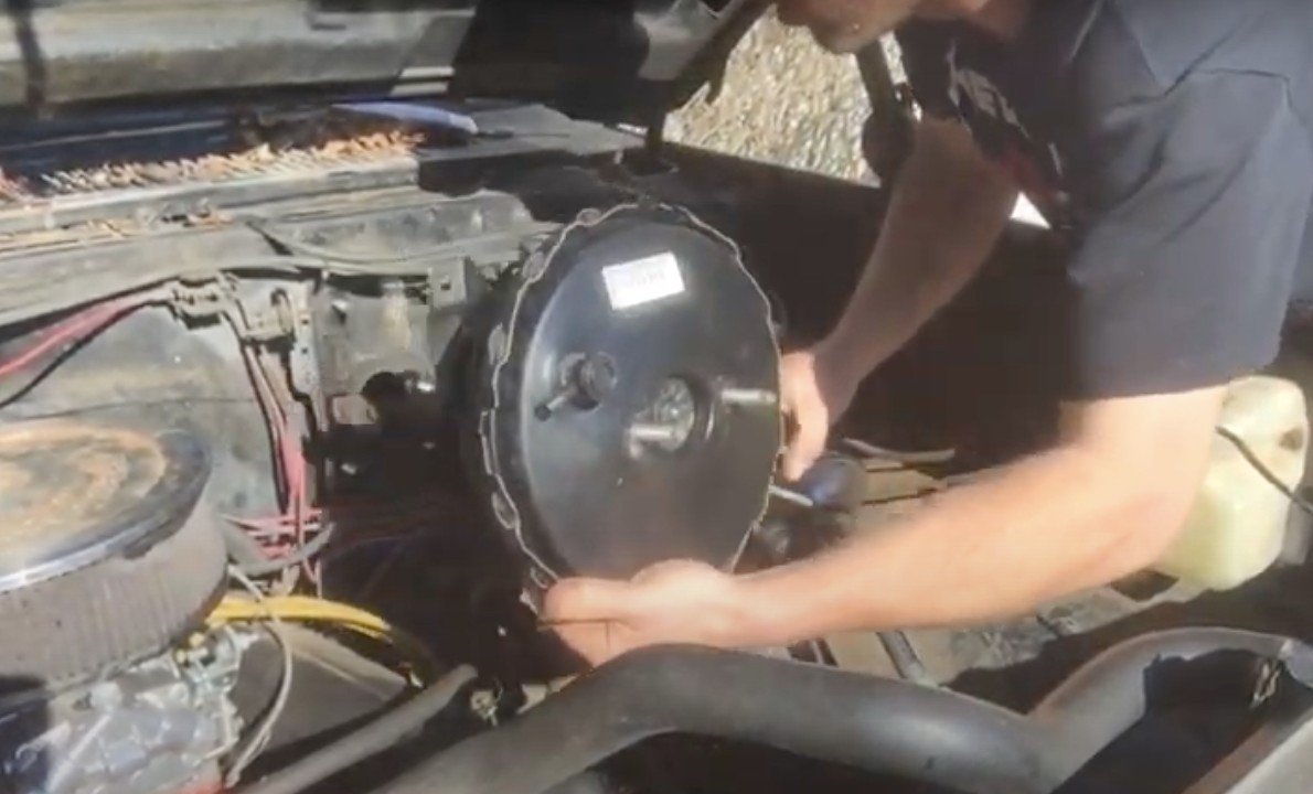 Mobile mechanic installing replacement brake booster in Anaheim, CA.