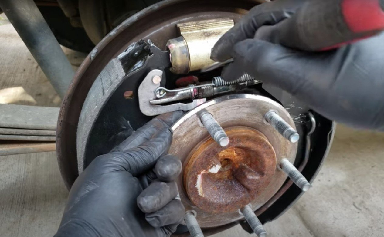 Picture of mechanic doing a rear drum brake job on a truck in Anaheim.