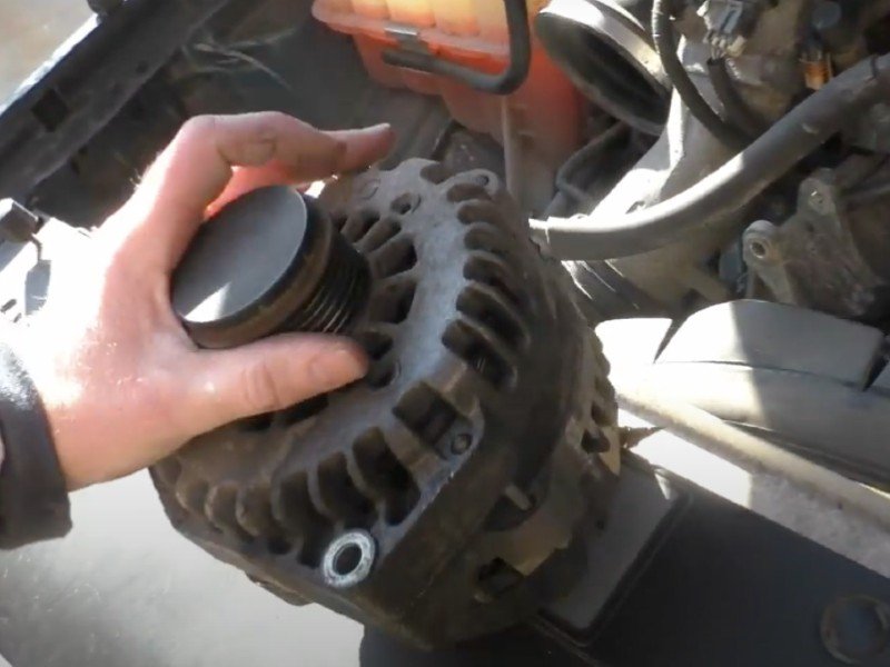 Photo of mobile auto repair mechanic changing truck alternator in Anaheim.